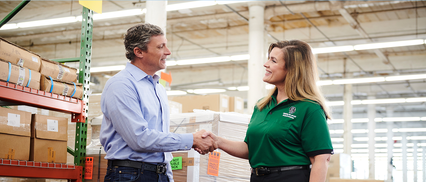 OD driver shaking hands with customer.